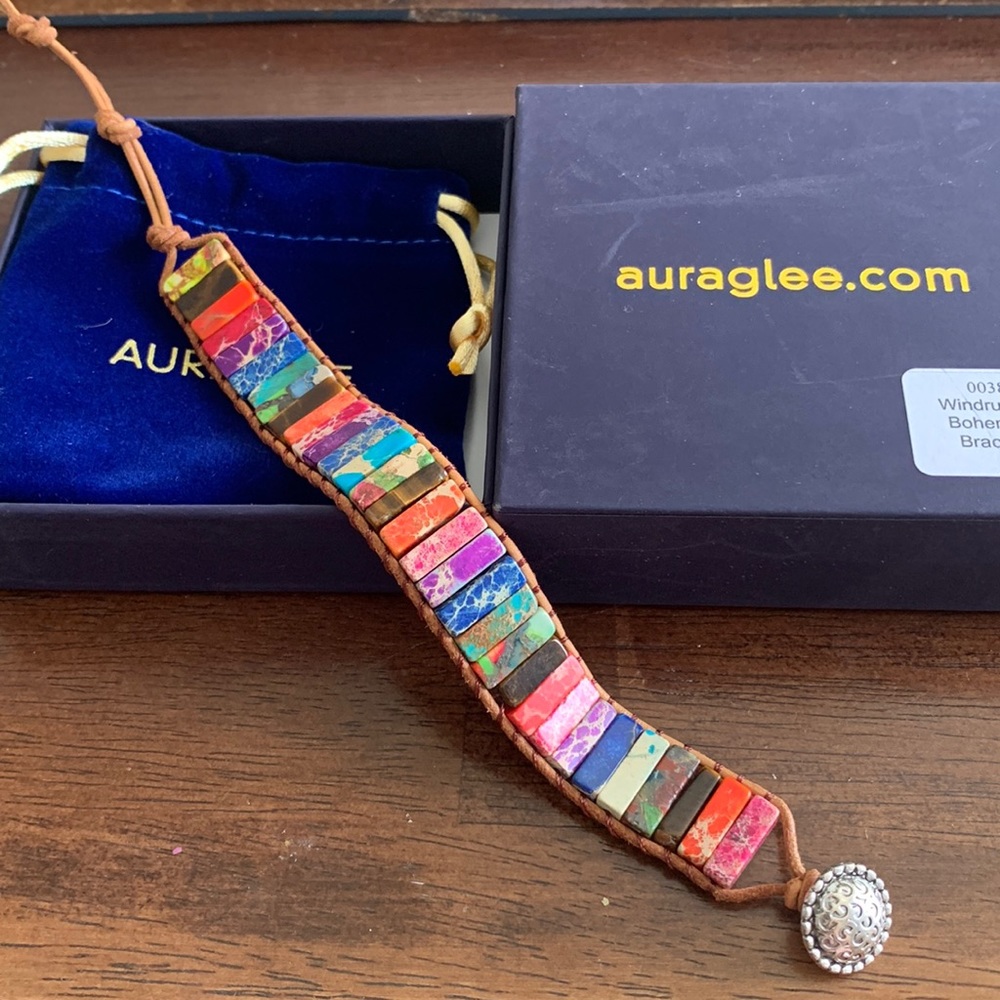 Auraglee wind runner, bohemian bracelet. Comes in its original box and pouch.
